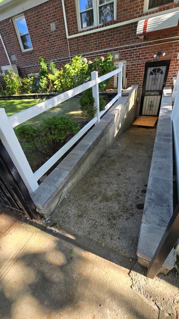 Basement entrance stairwell with new concrete wall caps